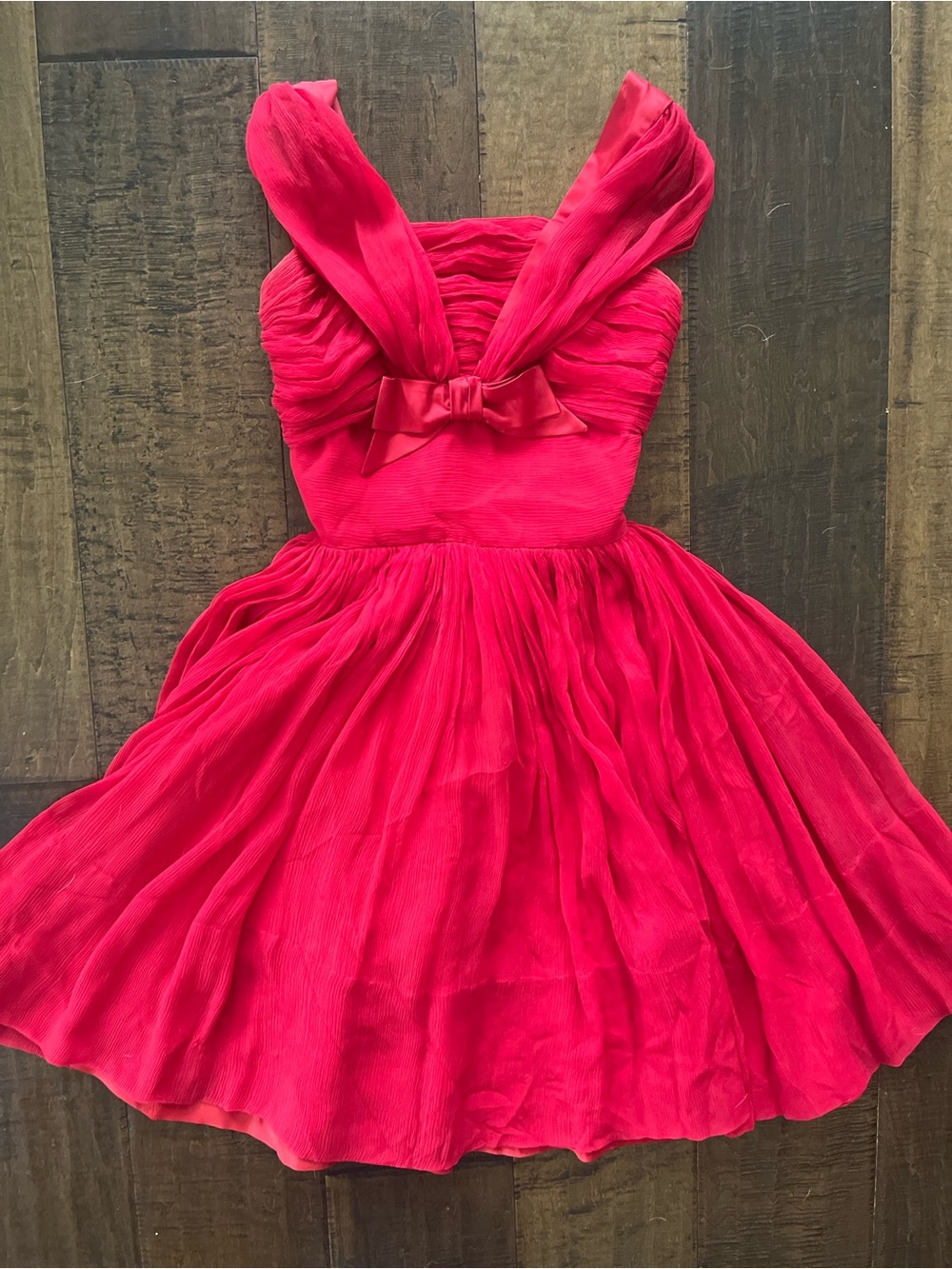 Vintage 1950s red chiffon cocktail party dress with a ruched bodice and bow